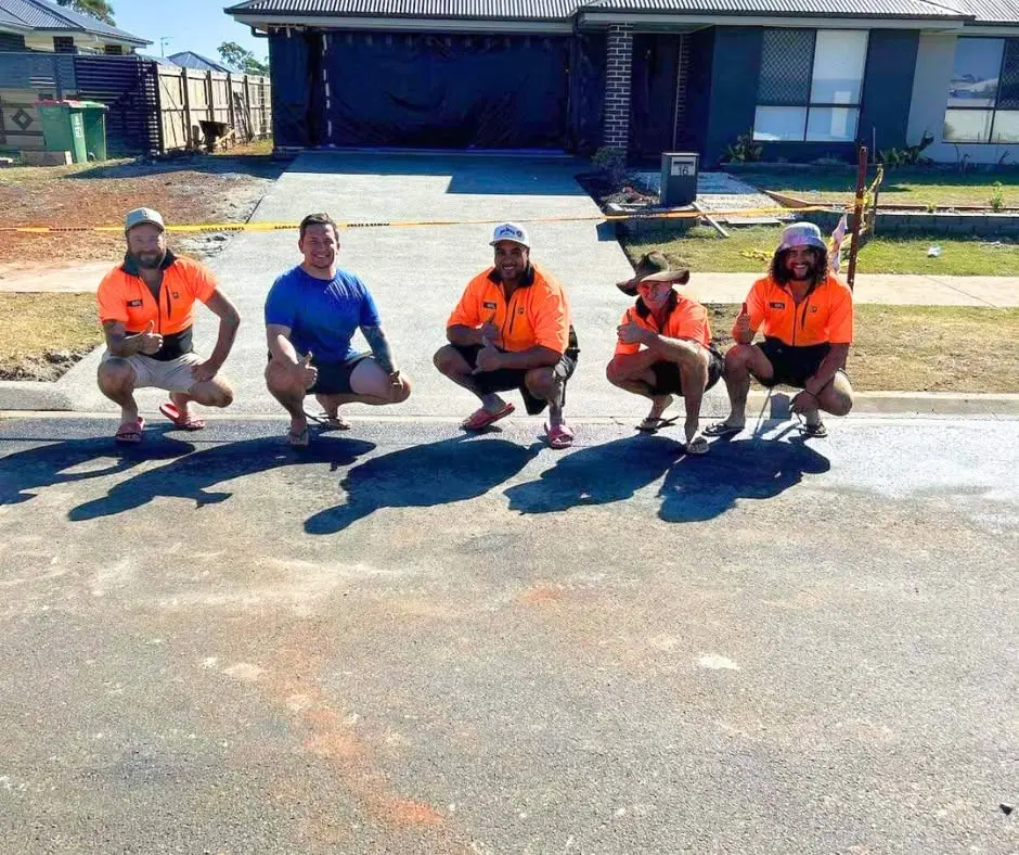 Five RFL crew members on a finished house slab