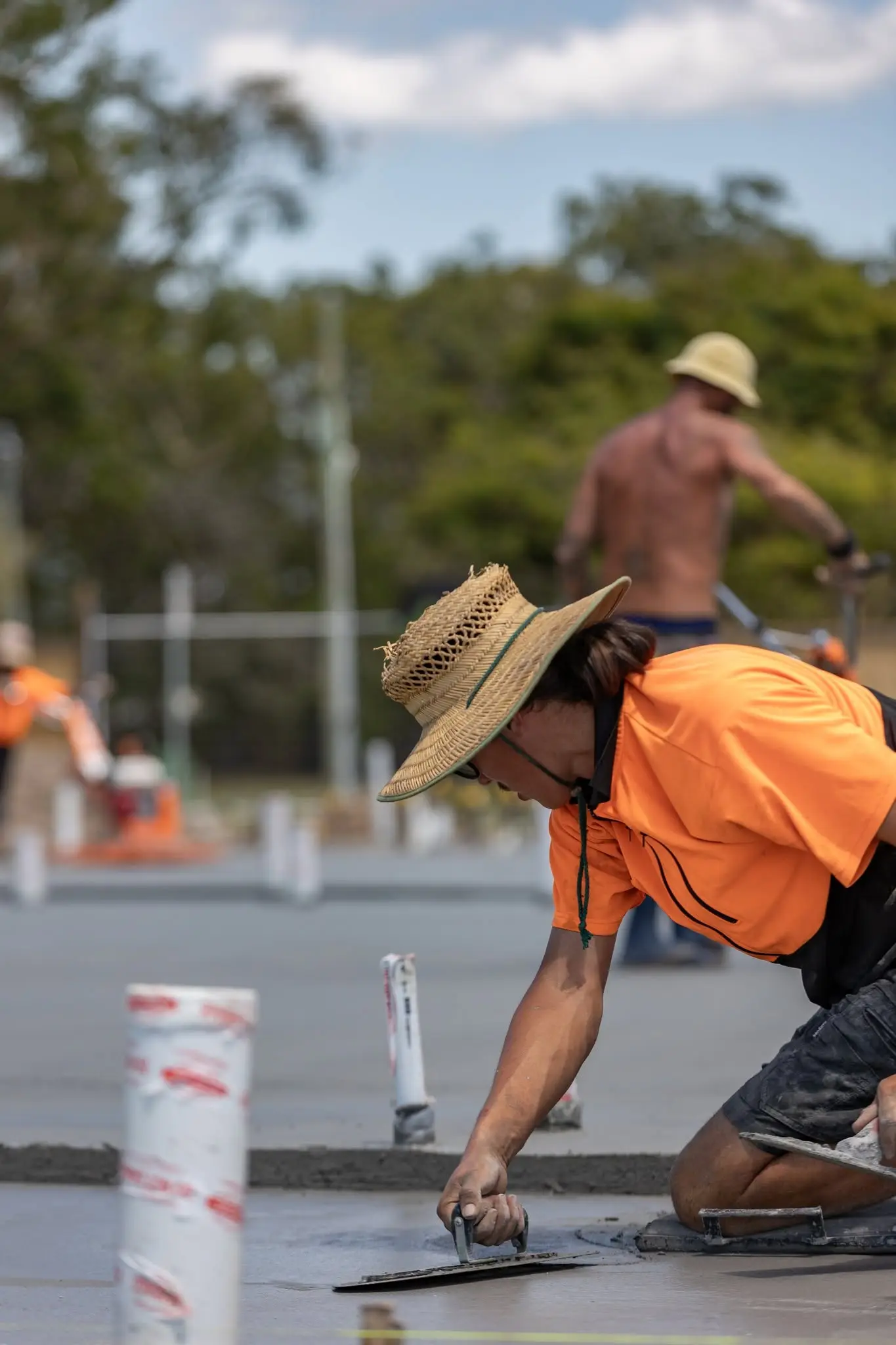 RFL crew member screeding fresh concrete